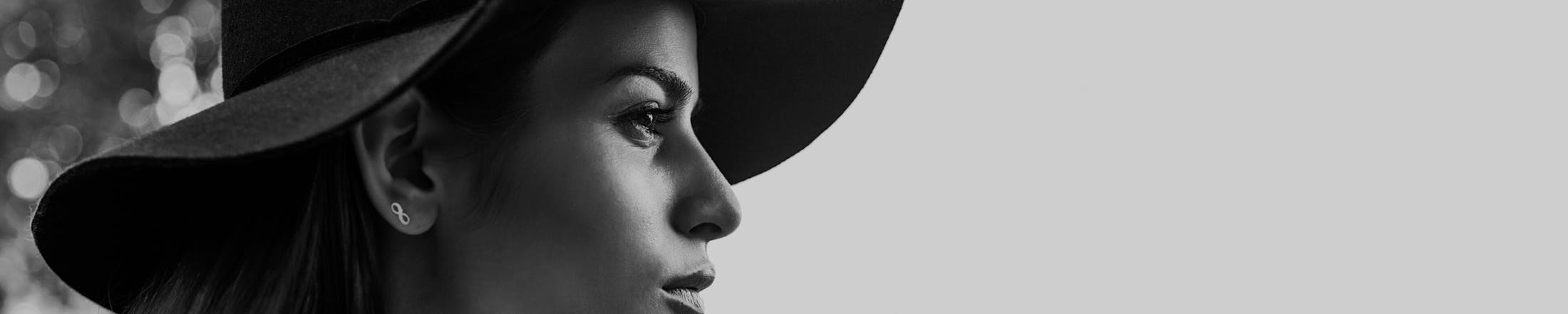 Black and white photo of woman wearing sun hat