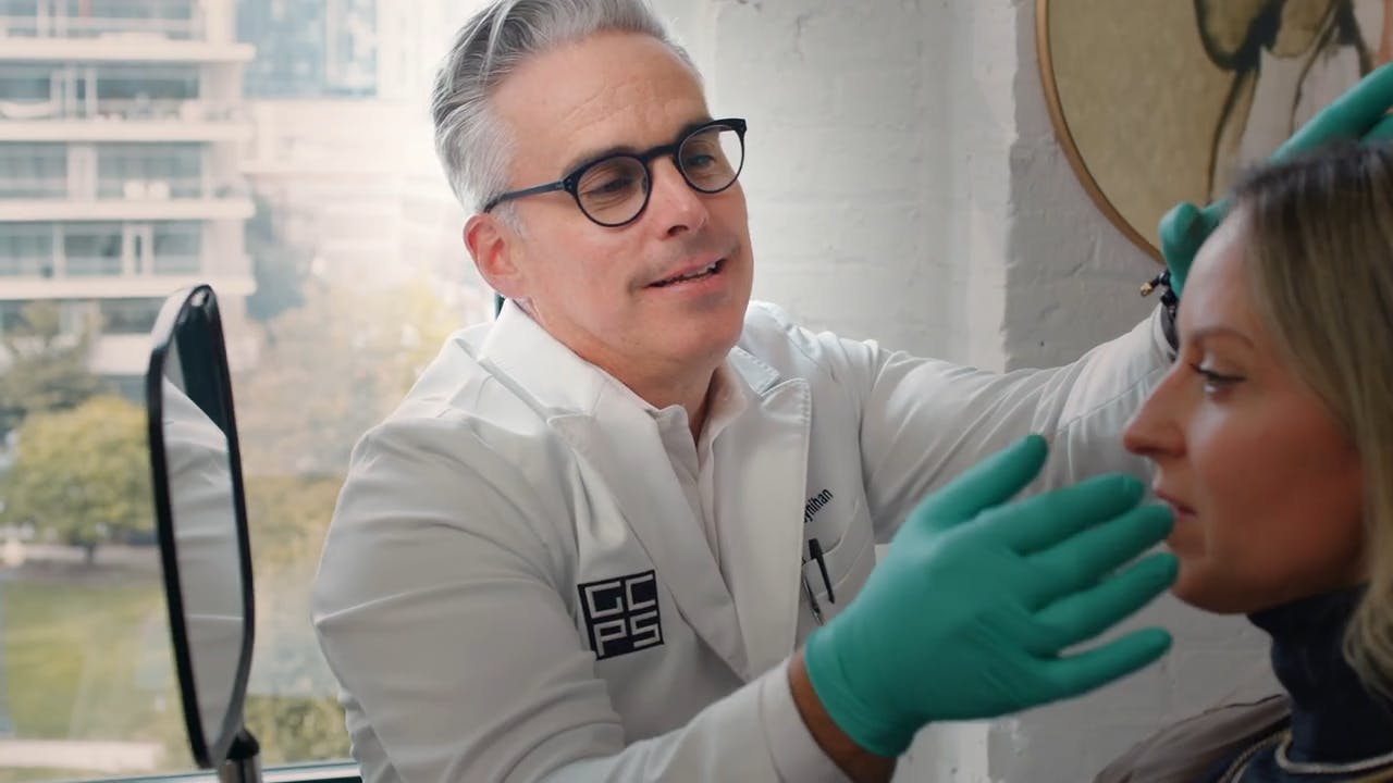 Dr. Moynihan examining patient face