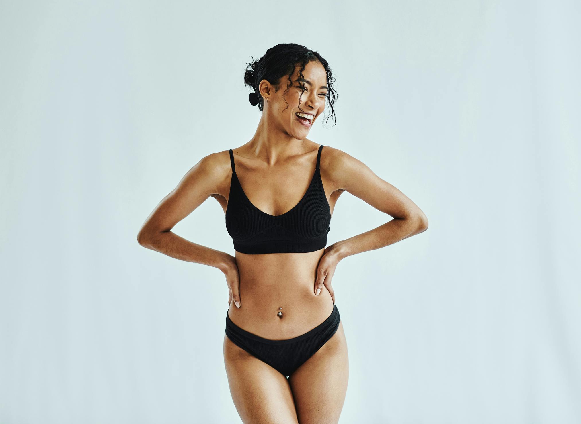 woman in a black bikini posing for a picture