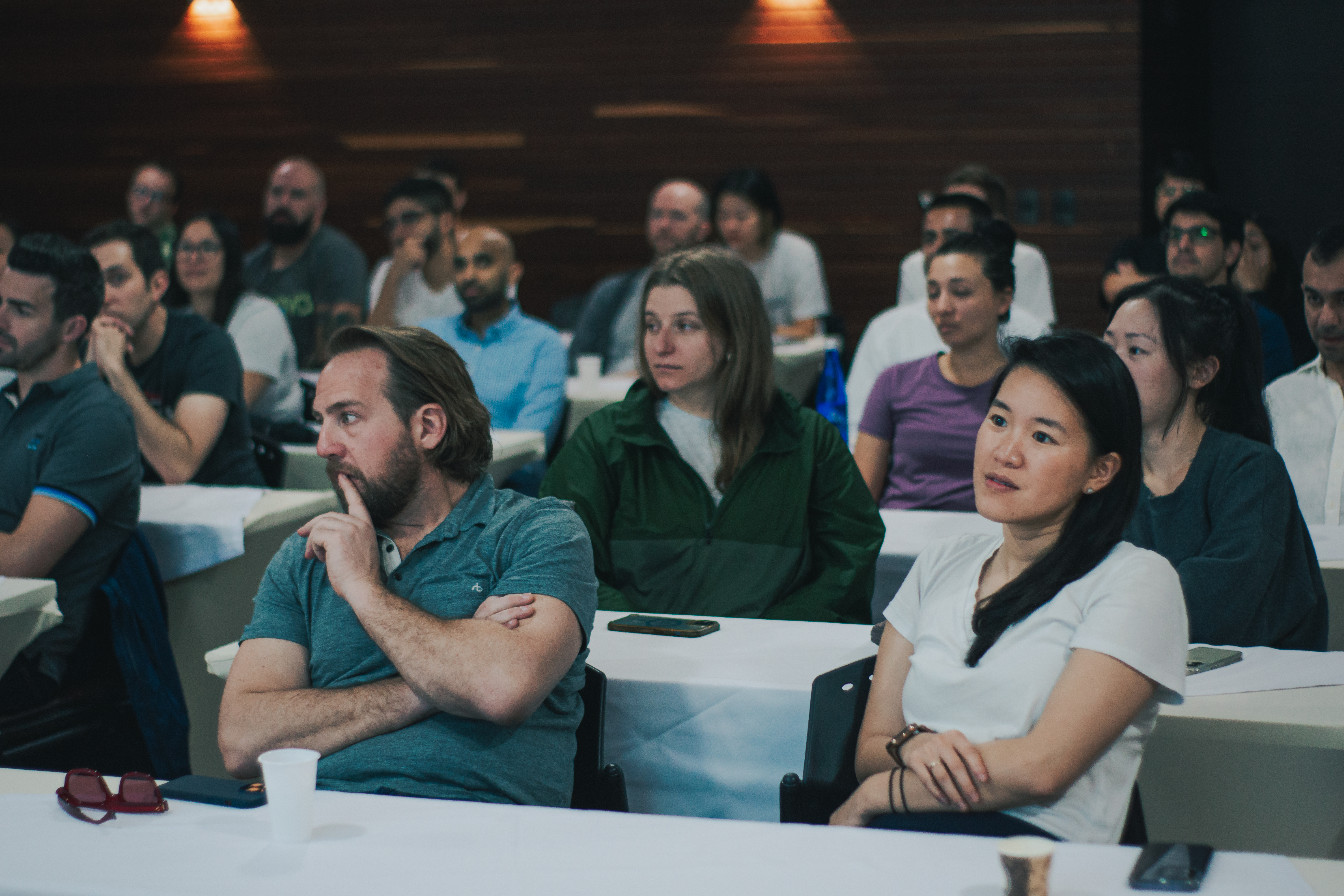 A group of coworkers listening to a presentation