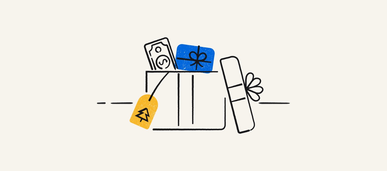 A gift box with money and gift cards inside.