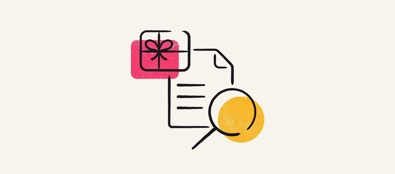 A gift card, a piece of paper, and a magnifying glass.