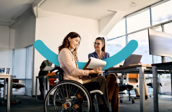 Two women in an office, one woman is in a wheelchair occupational health assessment