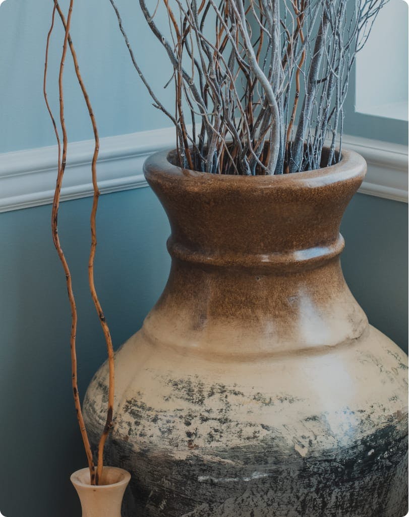 Two vases with decorative branches