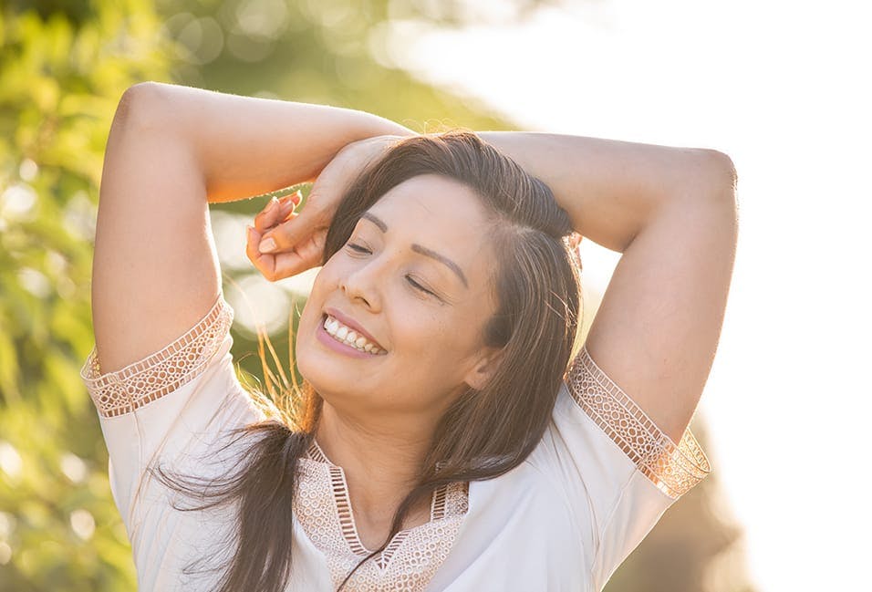 smiling woman with long brown hair