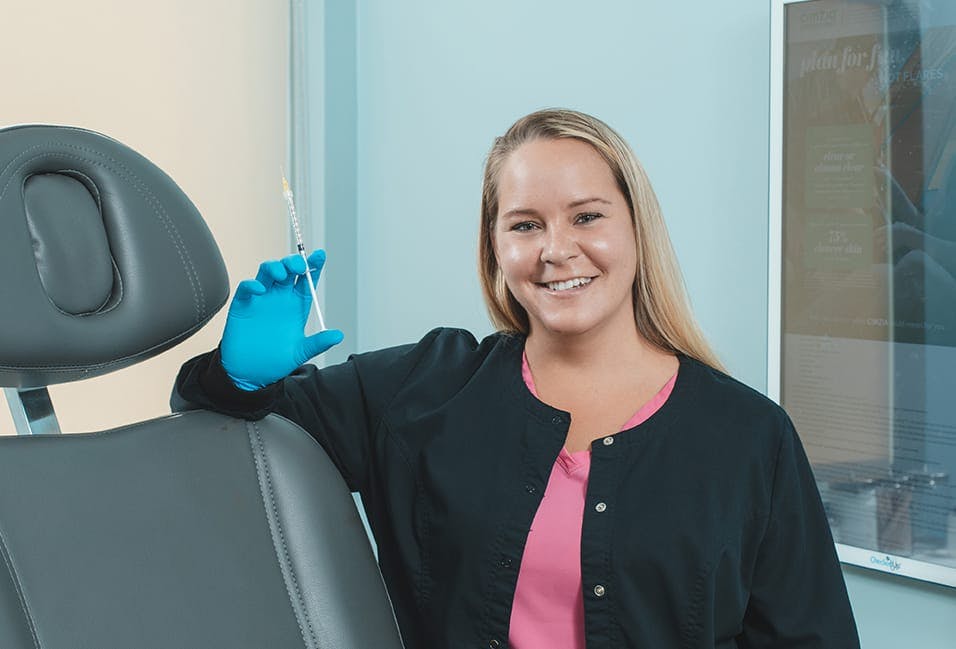 smiling woman in a chair