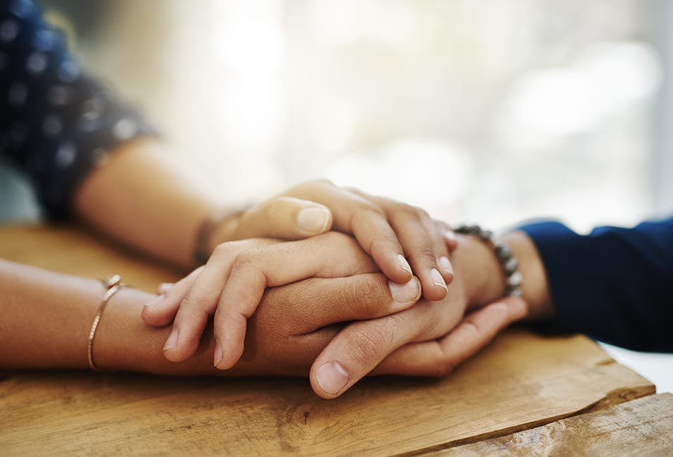 two people holding hands