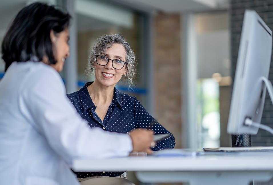 Physician working with a female patient