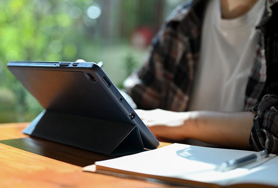 Tablet being used by someone at a desk