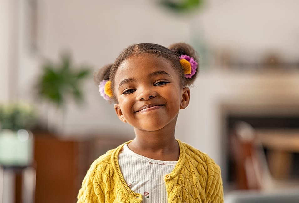 Young girl smiling at the camera