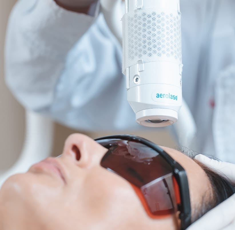 man getting a laser treatment