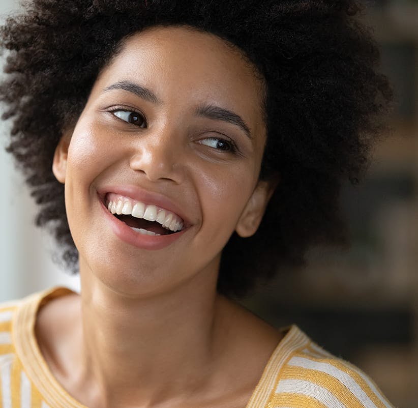 smiling woman with afro hair