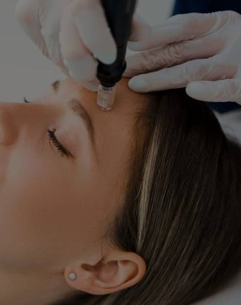 Woman undergoing facial treatment