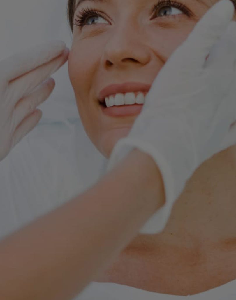 Woman being treated by dermatologist