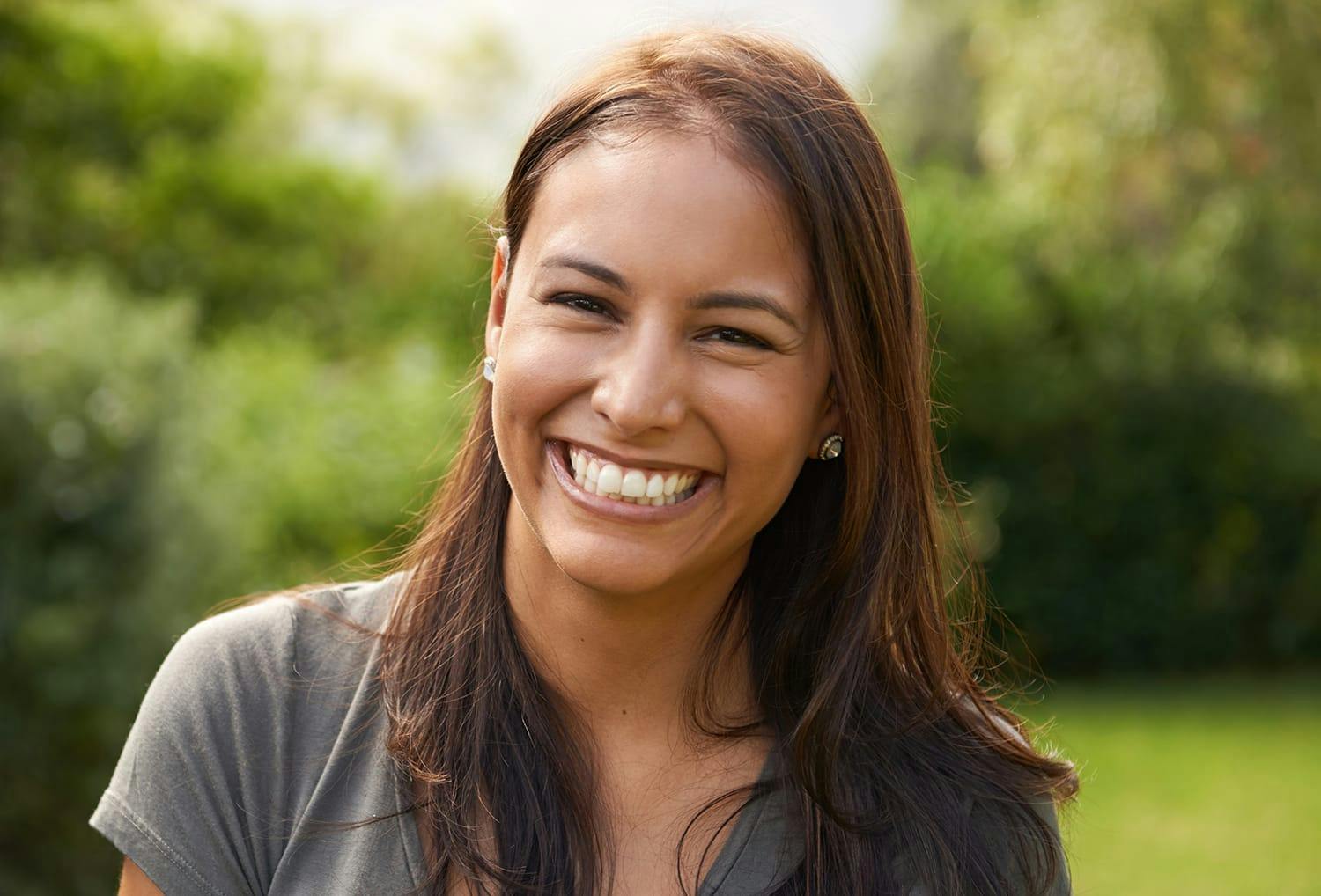 smiling woman with a green shirt