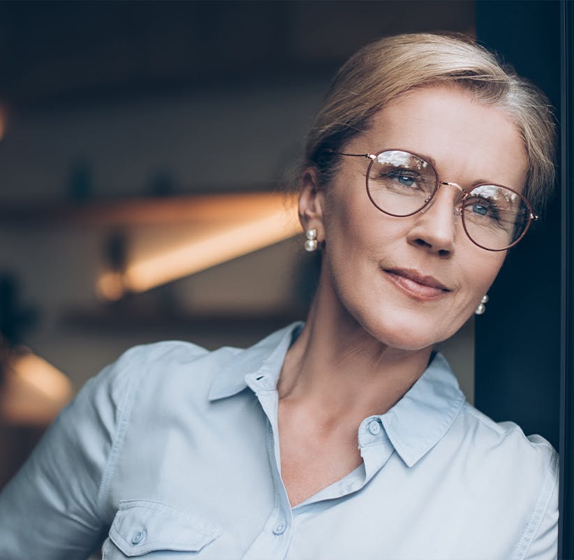 Woman with glasses in a blue shirt