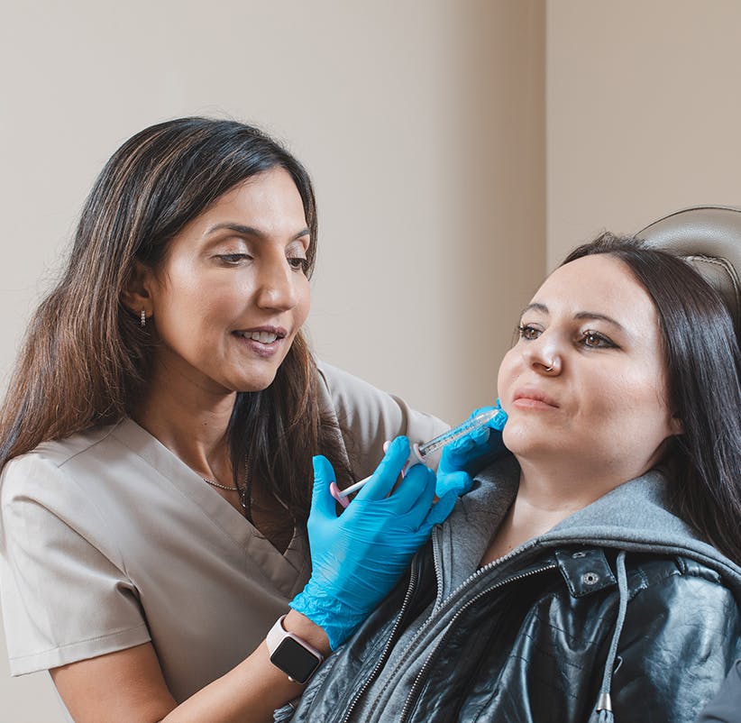 woman getting a facial injection