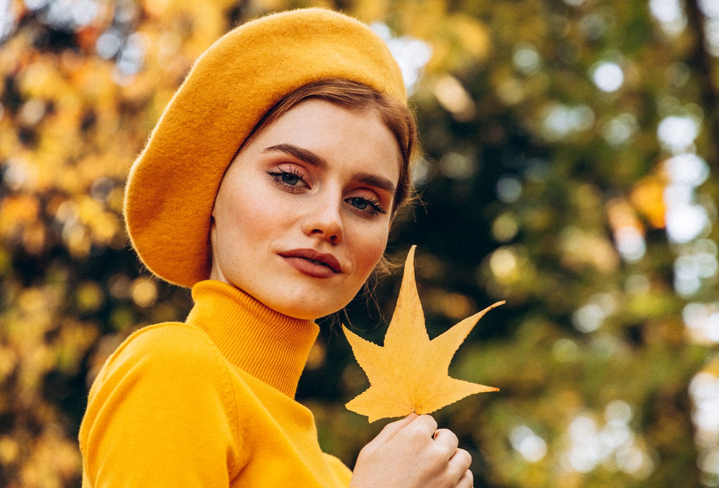 Woman holding a leaf