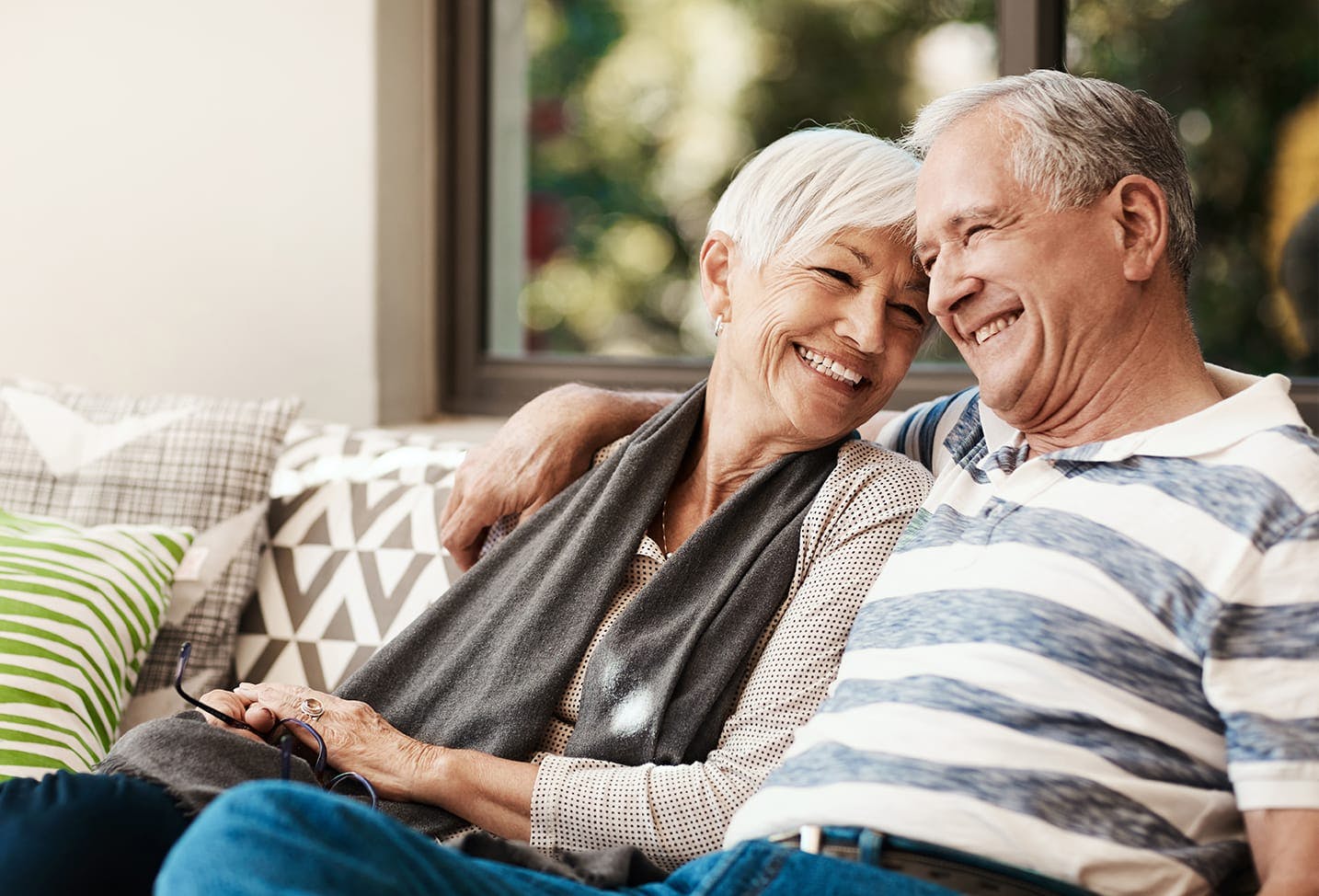 Woman and man sitting on a couch