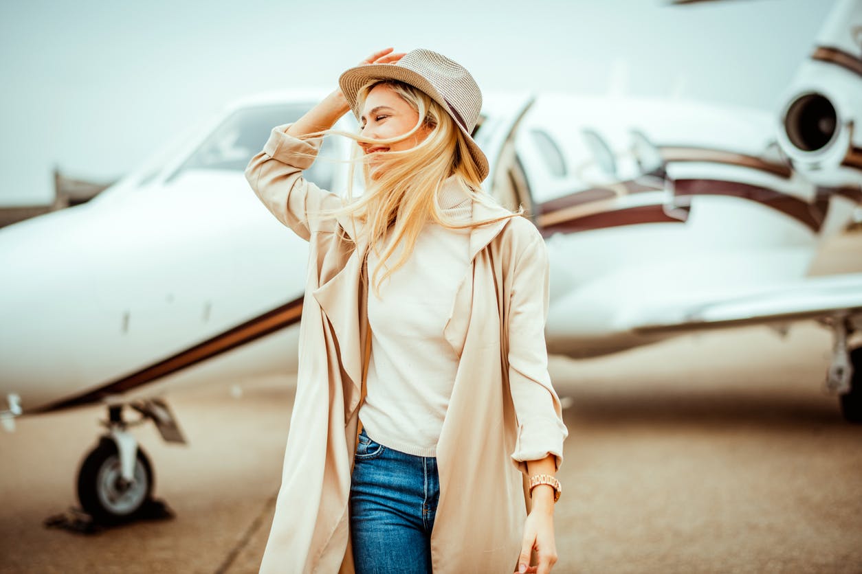 Woman in front of an airplane