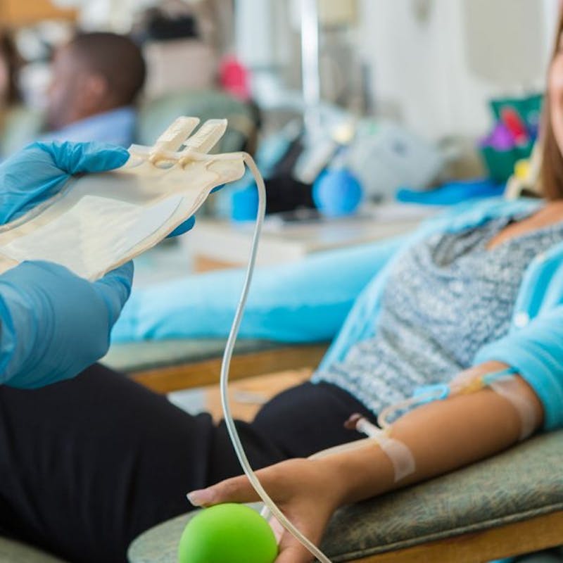 someone is getting liquid transfusion with doctor