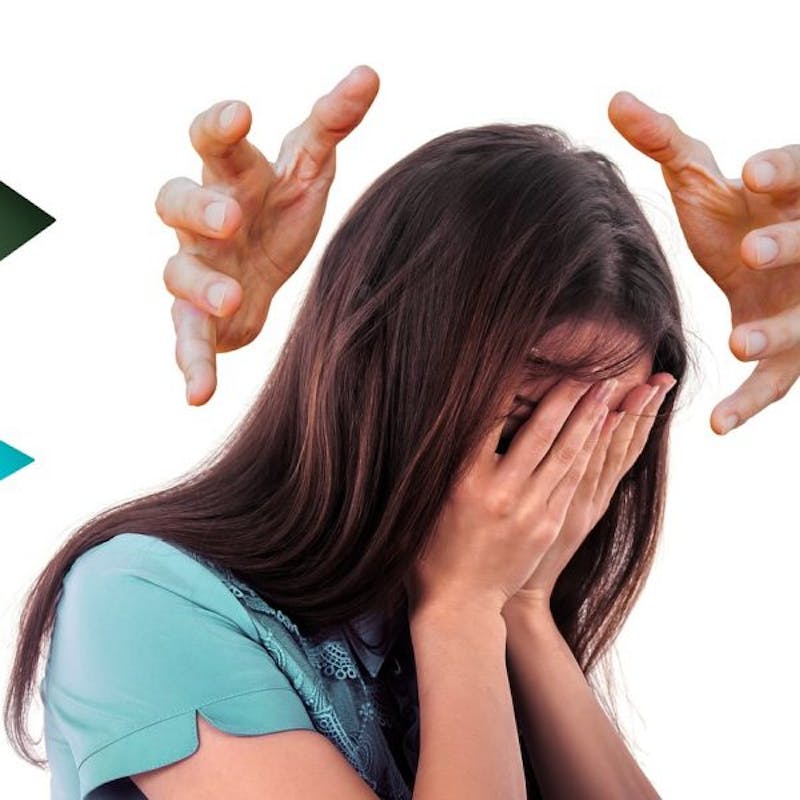 woman with hands on her face and hands reaching for her head