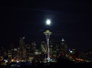 Space needle under a full moon
