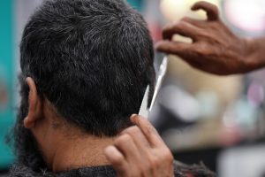 man getting hair cut