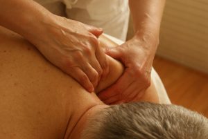 man receiving back massage