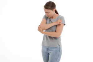 woman experiencing elbow pain