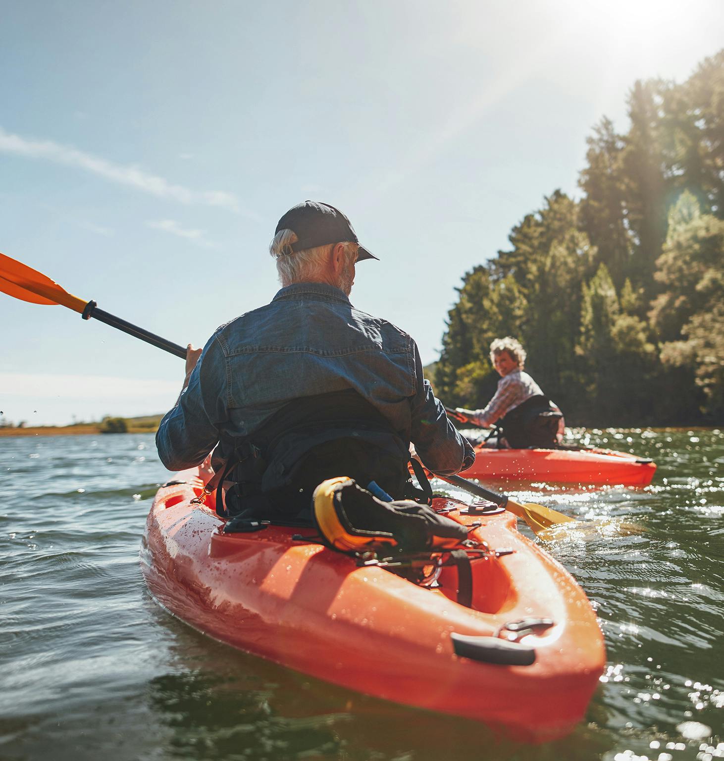 there are two people in kayaks paddling on the water