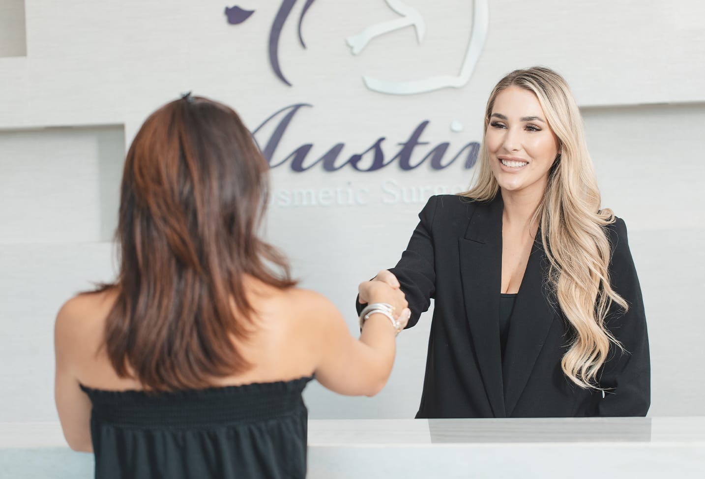 patient shaking hands with one of the staff members at ACS