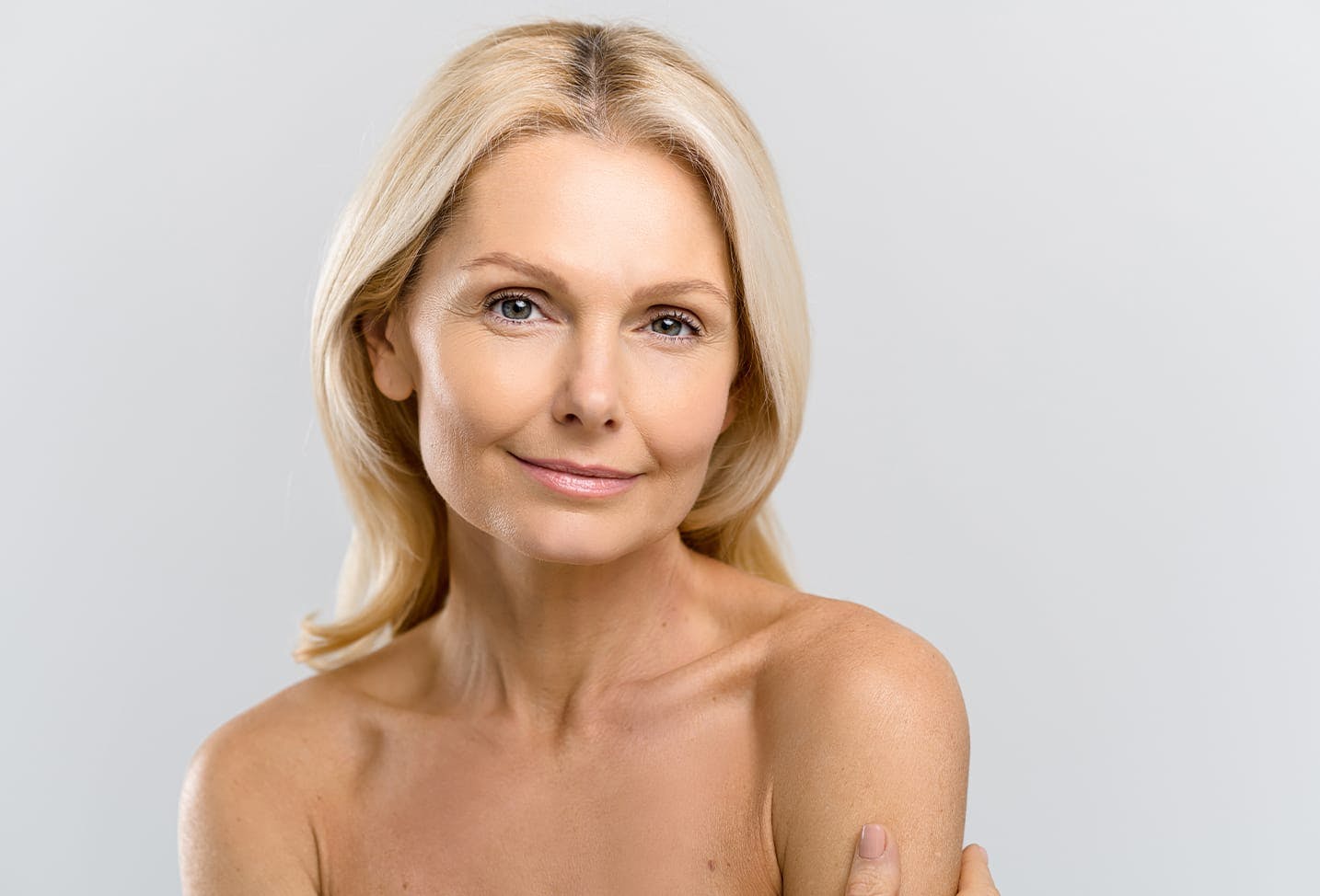 a blonde woman with little makeup on