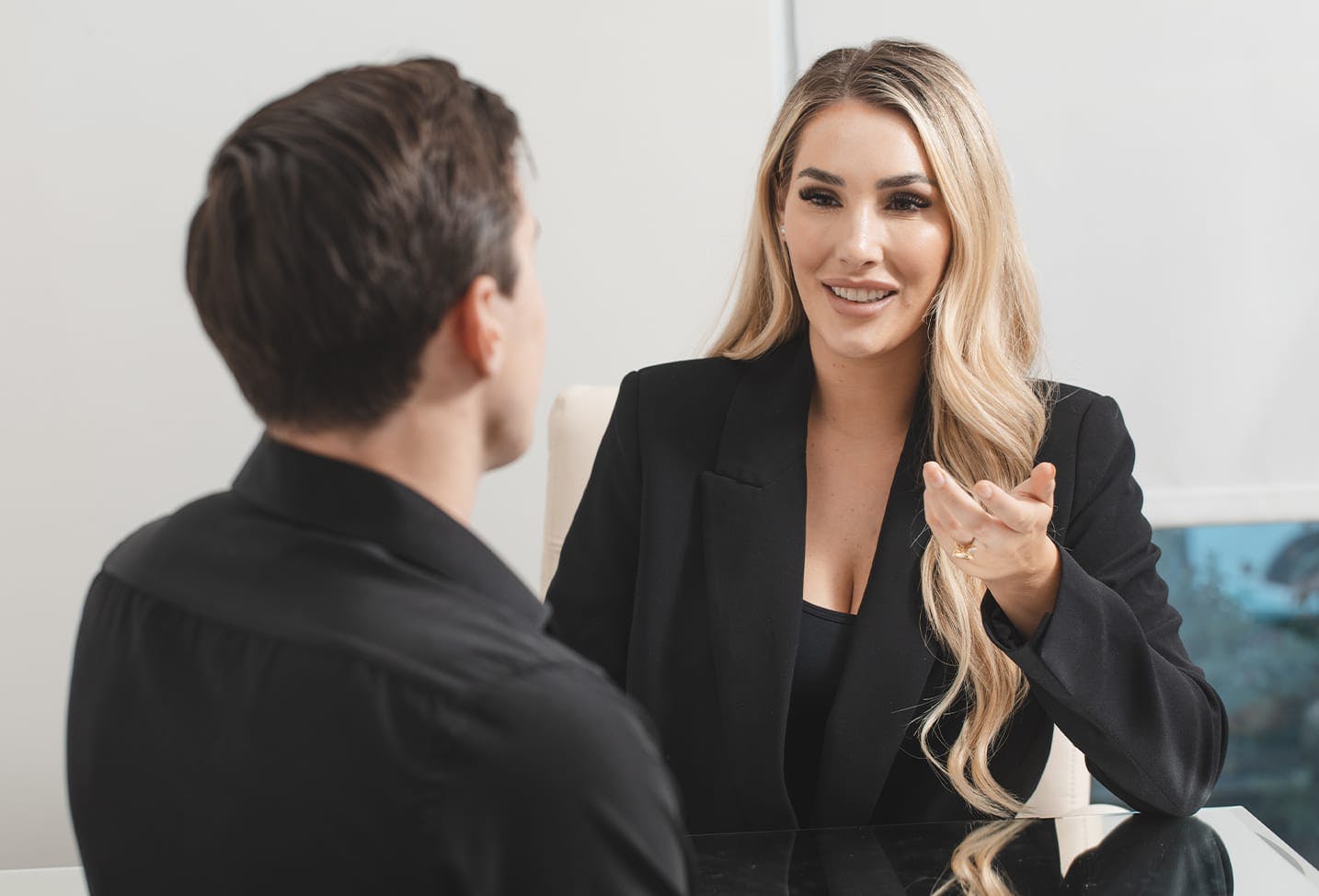 an image of a RN at ACS giving a consultation with a male patient