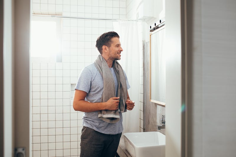 male model looking in mirror