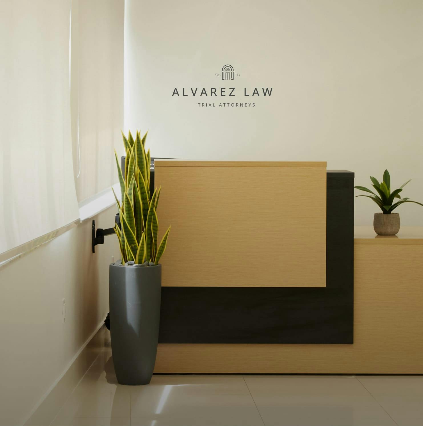 The Alvarez Law Firm Sign in the office