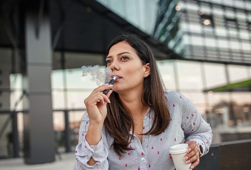 Woman smoking e-cigarette