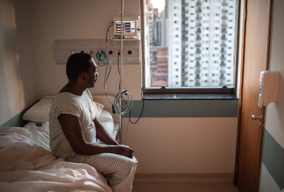 Patient sitting down in hospital bed