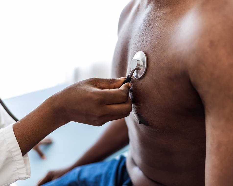Person having their heartbeat checked