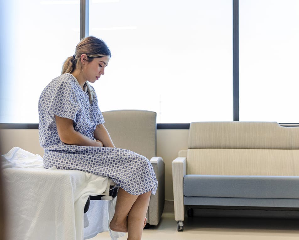 Patient sitting in hospital bed