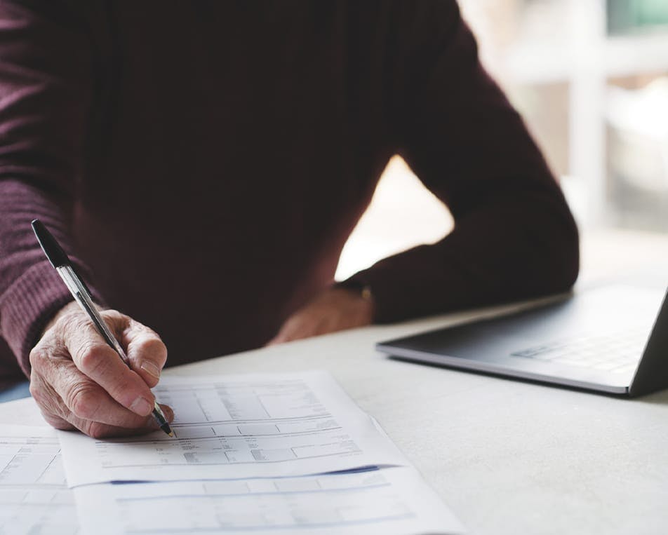 Person writing on paper