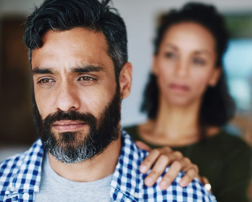 Woman comforting sad man