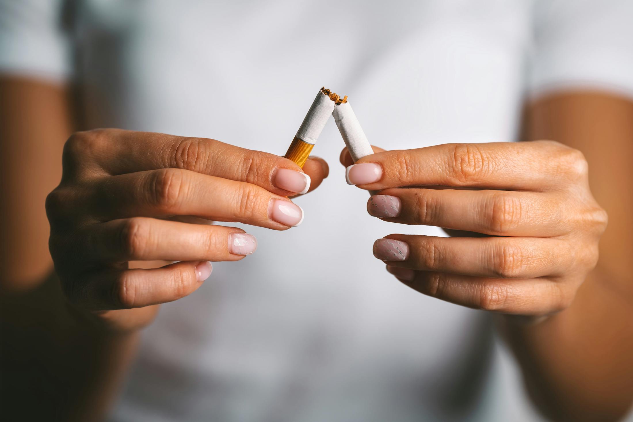 Woman breaking a cigarette