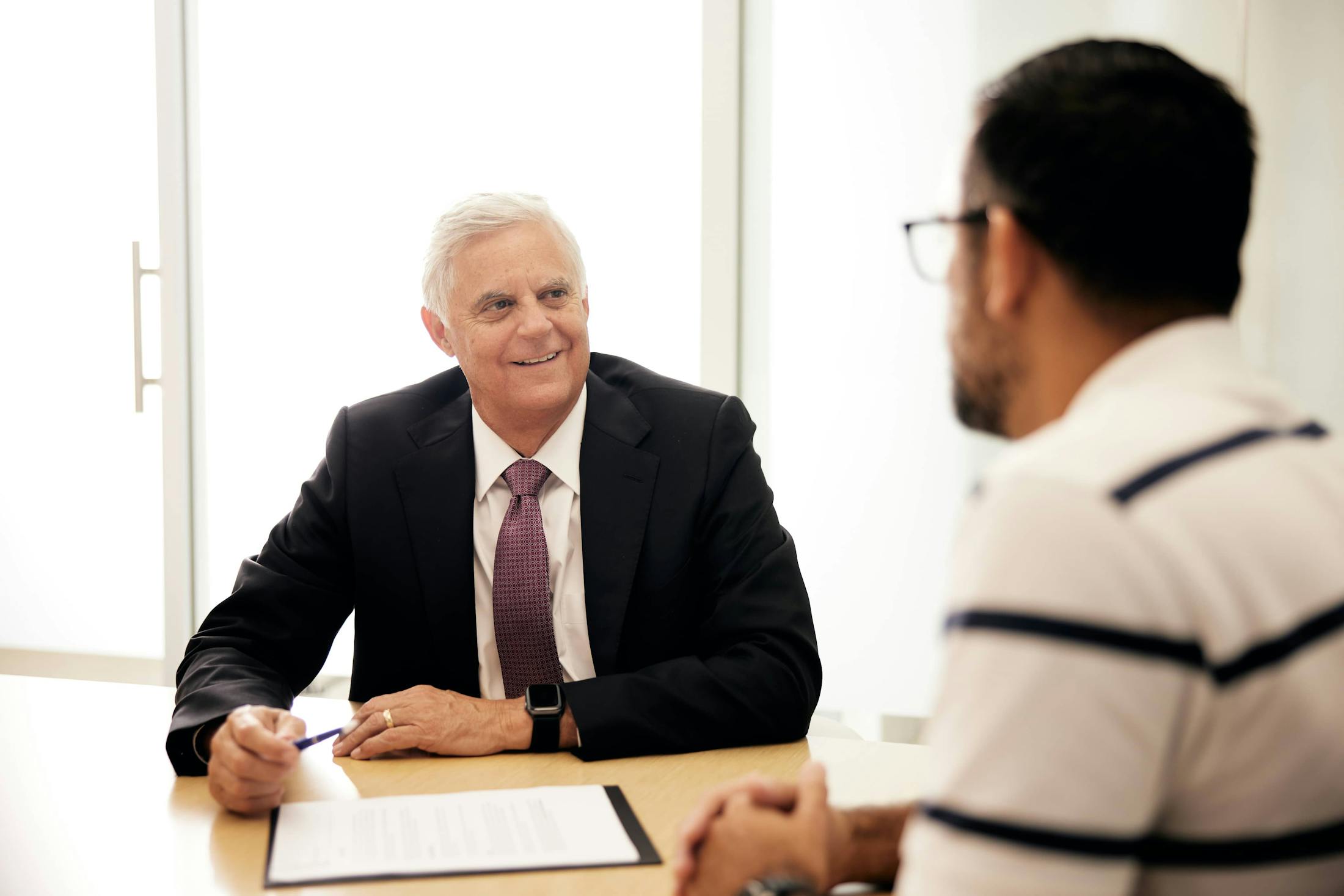 Alex talking with a client