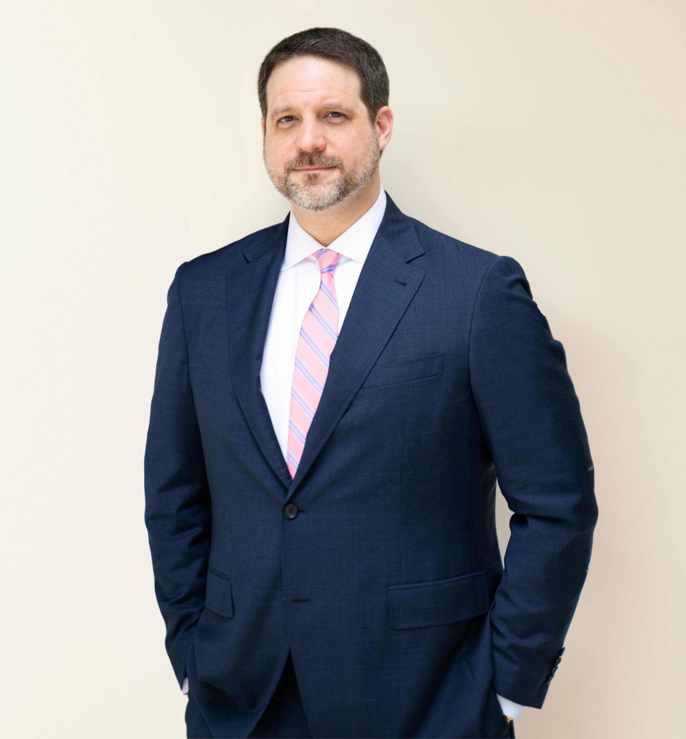 Attorney Michael LaMonica with beige gradient background