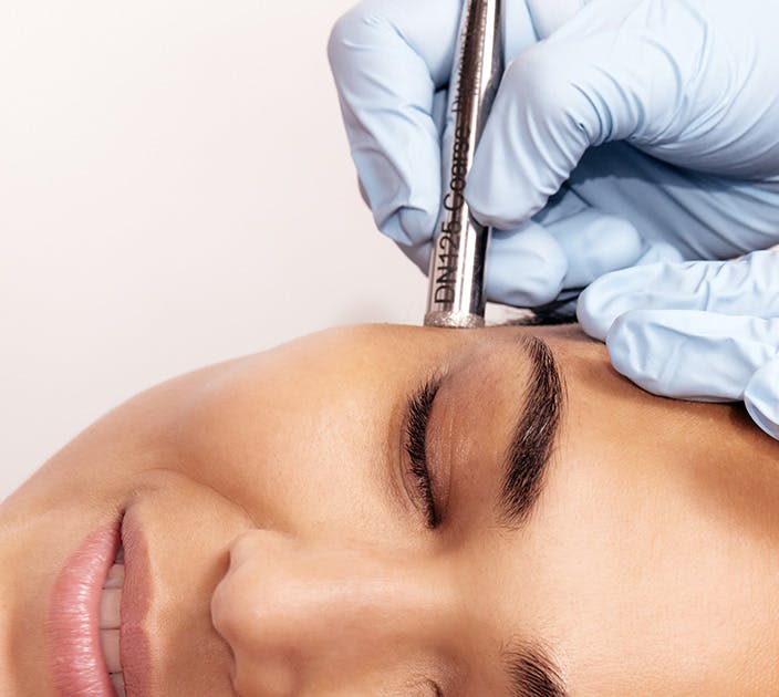 Woman being Treated on the face