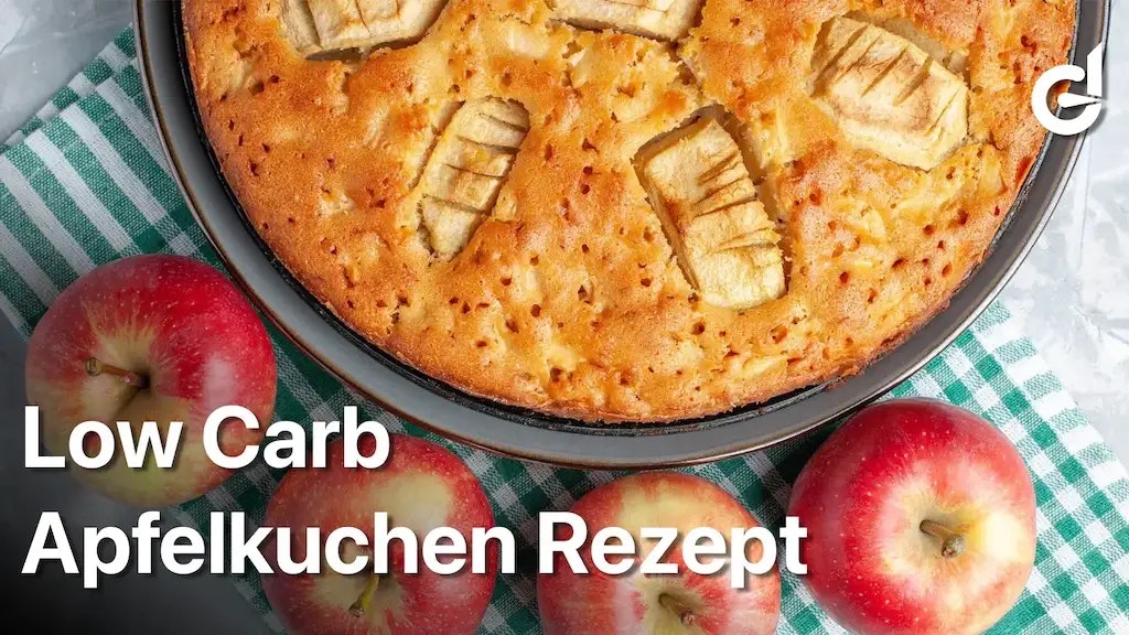 Bild von einem Apfelkuchen neben ein paar Äpfeln.