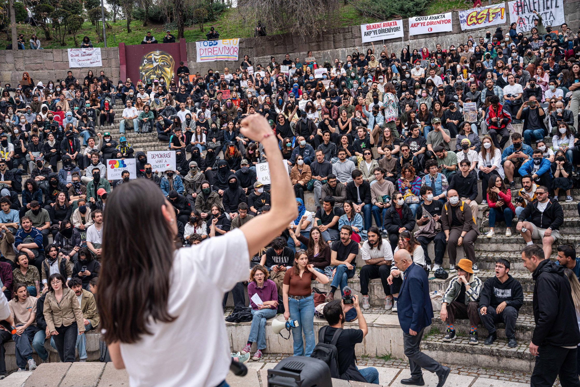 A student leads the crowd in chanting slogans during the forum. The protests that started after the arrest of the Republican People's Party (CHP) and Istanbul Metropolitan Mayor Ekrem Imamoglu continue. University students gathered at Se?menler Park, organised a forum and then marched to K?z?lay Square accompanied by the police. C
