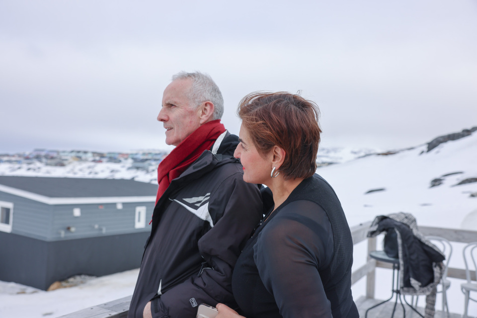 Co-chairs Ciarán Cuffe and Vula Tsetsi outside in a small village iin Greenland, looking away