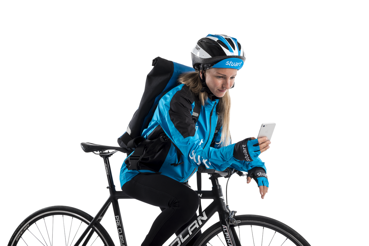 blonde woman wearing helmet and holding a mobile